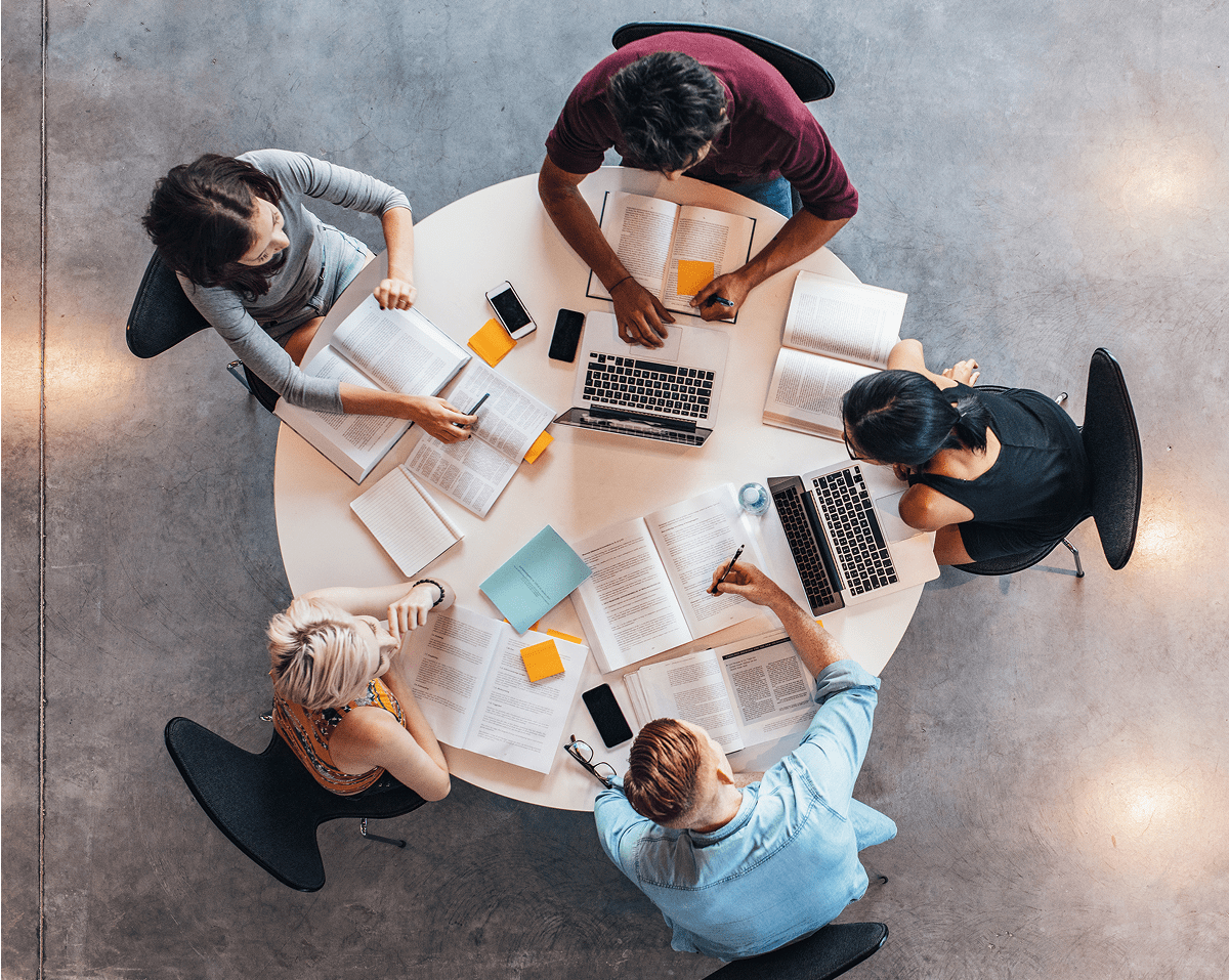 Students studying together around a round table.